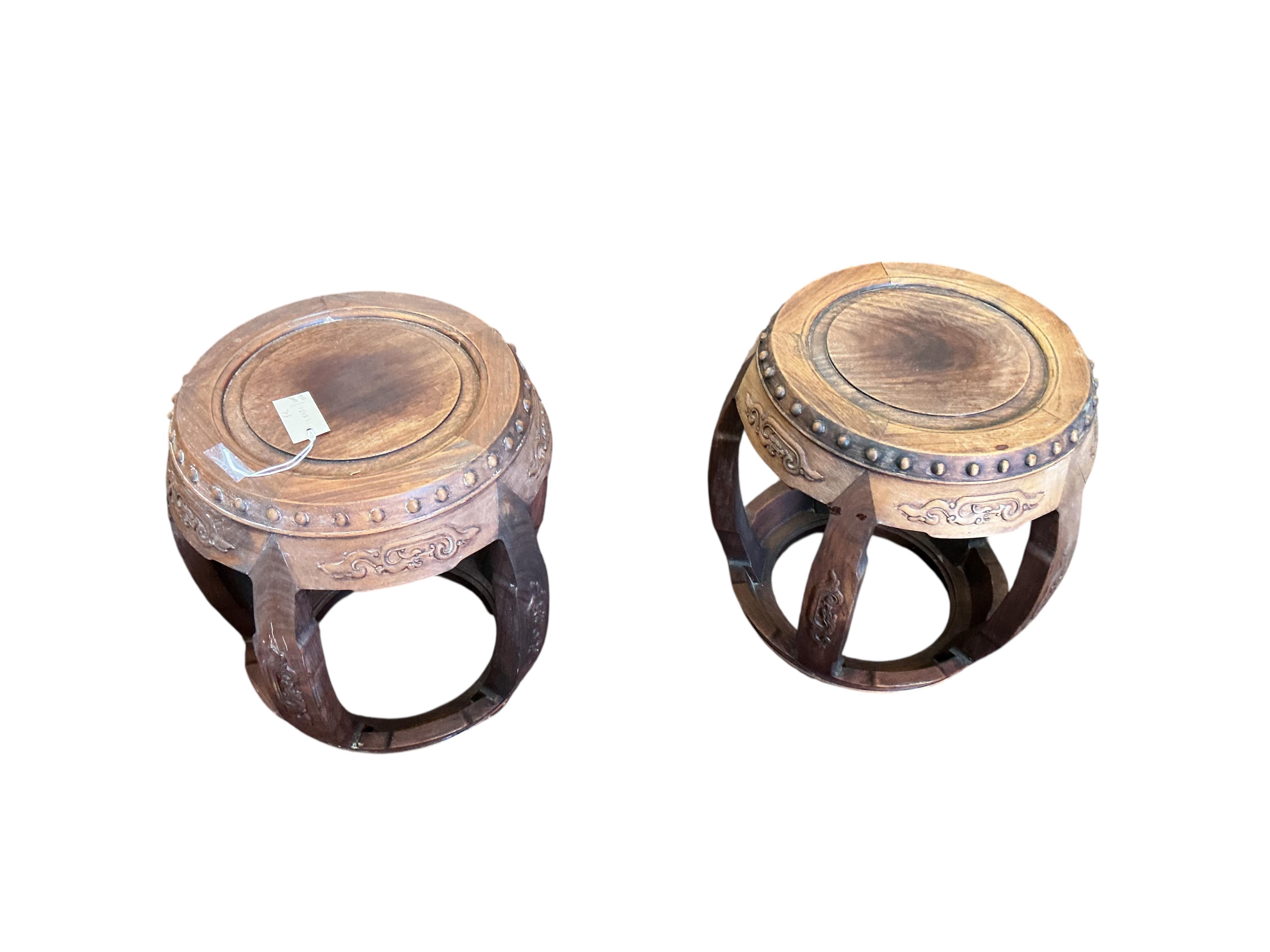 A pair of Chinese circular hardwood jardiniere stands, diameter 42cm, height 46cm